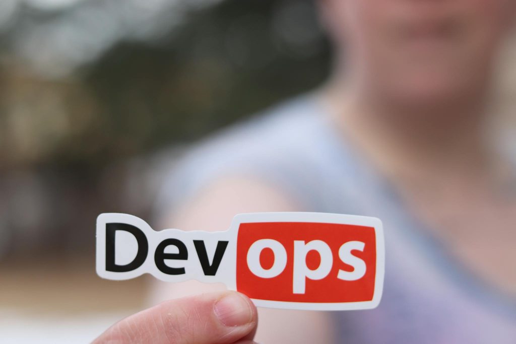 Maximizing Your Blog’s Reach: SEO Tips for Bloggers A close-up image featuring a DevOps sticker held by a person outdoors.