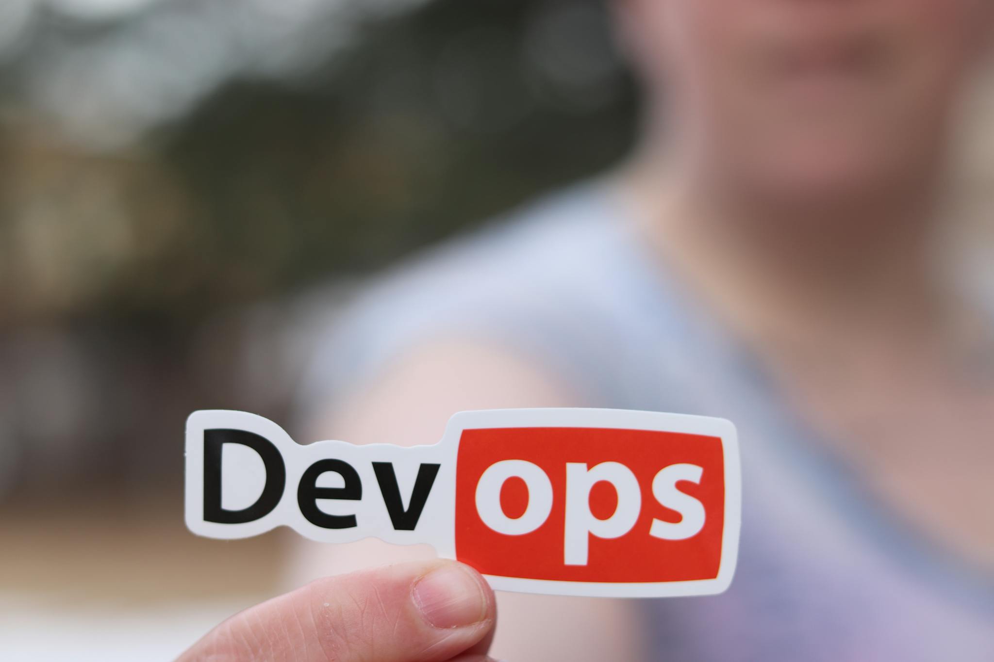A Close Up Image Featuring A Devops Sticker